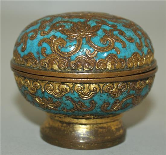 A Chinese gilt bronze and champleve enamel box and cover, 18th century, diam. 6.5cm, wear and minor losses